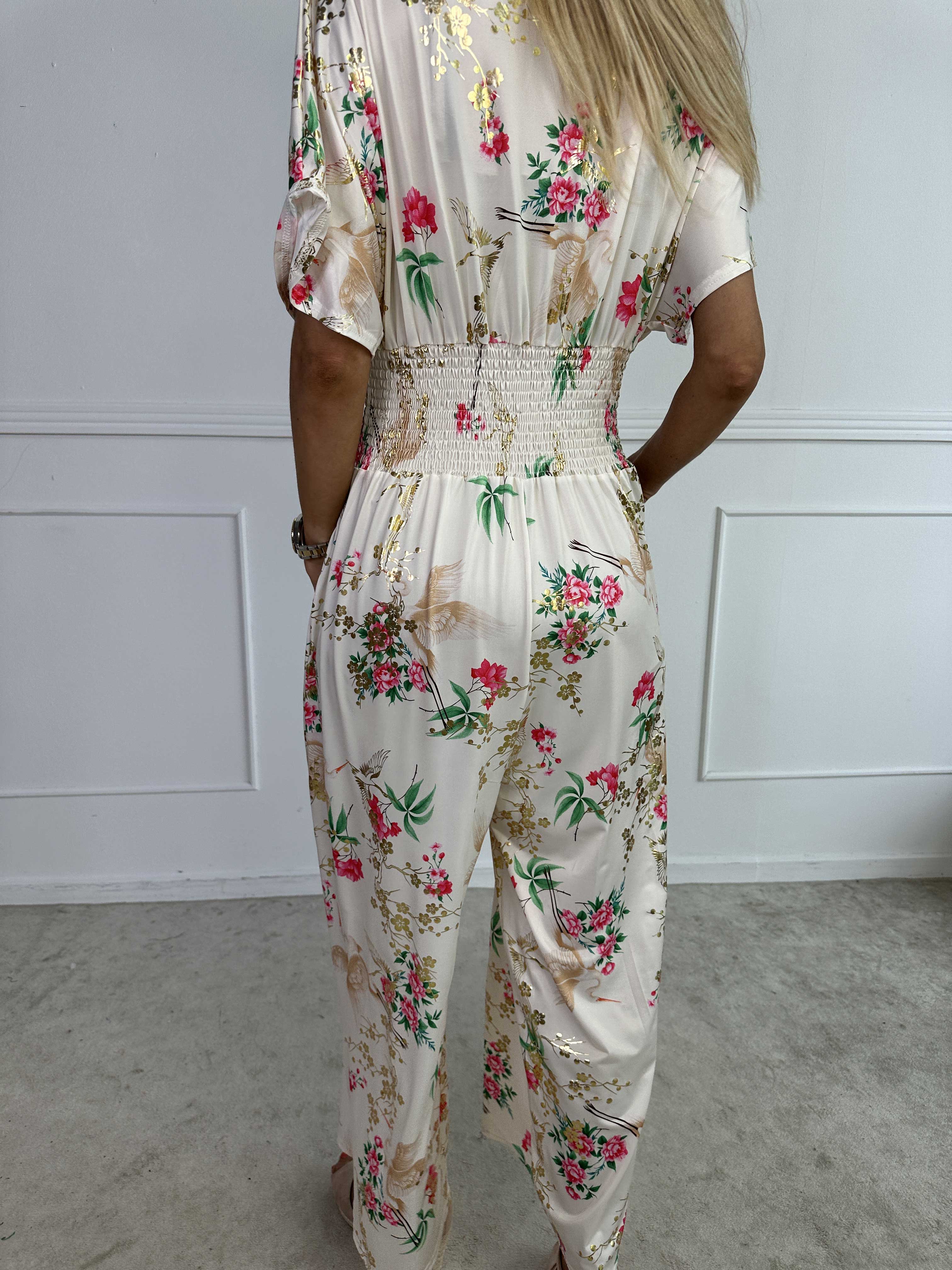 Pams Fly Jumpsuit - Elastisk buksedragt med blomster- og fugleprint
